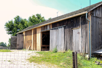 old barn with wooden fence