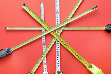 Measuring tapes on color background