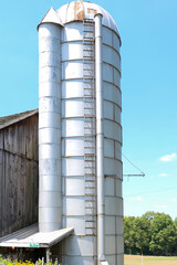 grain silo next to a barn