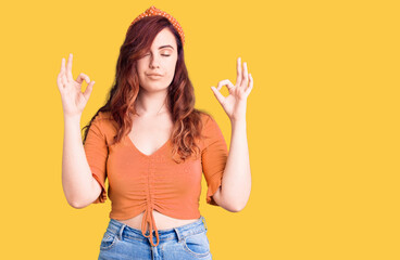 Young beautiful woman wearing casual clothes relax and smiling with eyes closed doing meditation gesture with fingers. yoga concept.