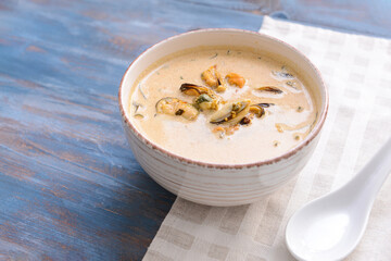 Bowl with tasty seaweed soup on table