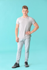 Fototapeta premium Young man on color background