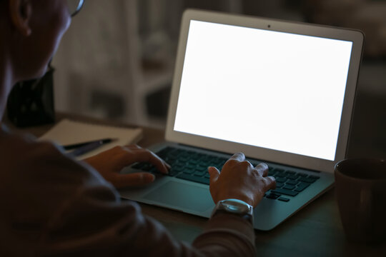 Young woman using laptop for online learning at home