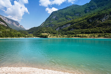 Panorama of Lake Tenno surrounded by Italian mountains with turqoise water