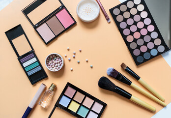 Set of professional decorative cosmetics, makeup tools and accessory on yellow background. Beauty, fashion, party and shopping concept. 