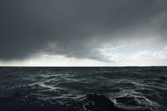 Glowing Clouds Above The Open Baltic Sea Before The Thunderstorm. Sweden Dramatic Sky, Epic Seascape. A View From The Yacht. Sailing In A Rough Weather