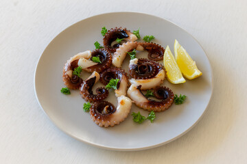 Grilled octopus with lemon and parsley