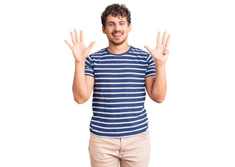 Naklejka premium Young handsome man with curly hair wearing casual clothes showing and pointing up with fingers number nine while smiling confident and happy.