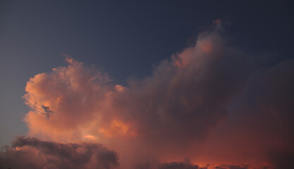 A huge pink cloud shot at dusk.