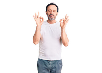 Middle age handsome man wearing casual t-shirt relaxed and smiling with eyes closed doing meditation gesture with fingers. yoga concept.