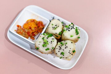 A dish of Chinese dim sum with soup