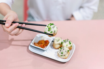 A dish of Chinese dim sum with soup
