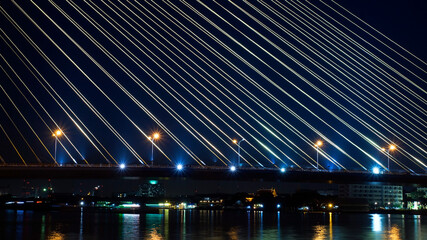 close up of suspension bridge at night