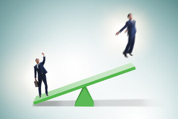 Competition concept with businessman and seesaw