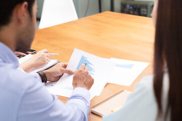 Fototapeta premium Close up hand man take note and talk job in business meeting.