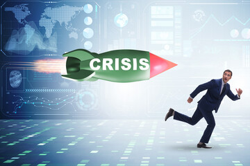 Concept of crisis with businessman chased by rocket
