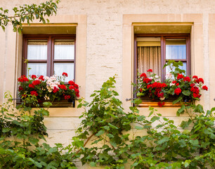 Fototapeta na wymiar A colorful window in a residential home in Rothenberg, Bavaria, Germany