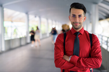 Young handsome Persian businessman exploring the city