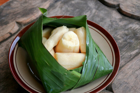 Tapai or Tape or Peuyeum are traditional food snack from indonesia, made from fermented cassava. Served on banana leaf
