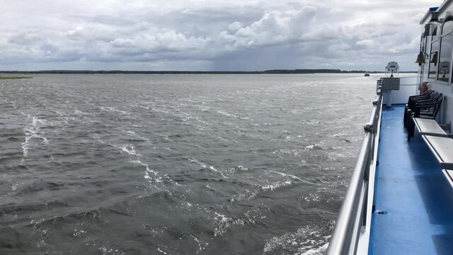 Motor ship heading for rain clouds. Recording from larboard.
