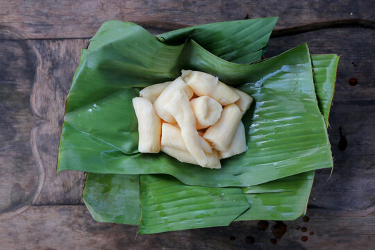 Tapai or Tape or Peuyeum are traditional food snack from indonesia, made from fermented cassava. Served on banana leaf
