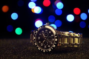 Beautiful Men's wrist metal watch with bokeh lighting effect	

