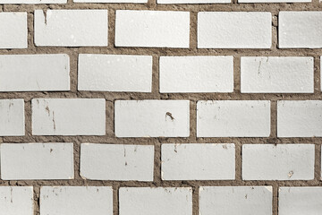 Fototapeta premium Abstract background old white brick wall with cracks and scratches. Landscape style. Great background or texture.