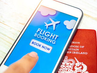 Flight booking application on smartphone with passport.