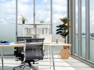 Fototapeta premium Modern office interior with huge windows with blue sky view.