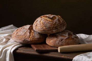 Freshly baked sourdough bread with floral decoration on it 