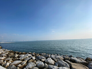 morning sunrise sea blue sky calm wave rocky shore Penang Malaysia