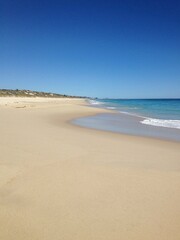 Fototapeta na wymiar Empty sand beach and blue sky in Perth Australia