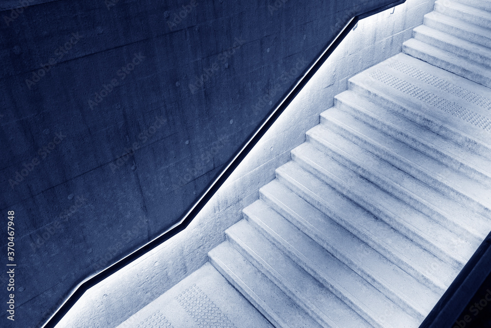 Aufkleber Empty stairway with illuminated bannister in modern architecture
