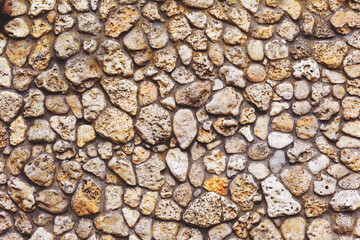Stone wall background. Background of stone wall of boulders and pebbles