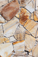 Stone wall background. Background of stone wall of boulders and pebbles