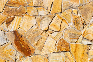 Stone wall background. Background of stone wall of boulders and pebbles