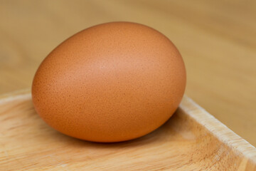 Close-up Fresh chicken eggs on a wooden tray
