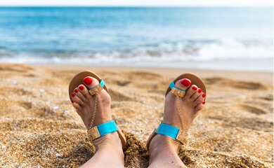 feet on the sanded beach