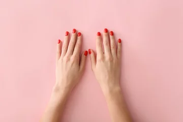 Küchenrückwand glas motiv Hands with beautiful manicure on color background © Pixel-Shot