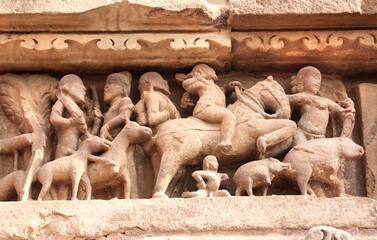 Famous human and animals sculptures at temple in Khajuraho, India