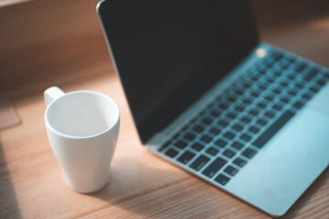 The coffee mug is placed on the desk.