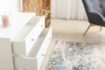 Modern chest of drawers in interior of room