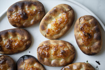 Traditional Finnish Karelian pasties on white marble background