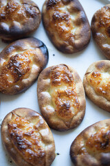 Traditional Finnish Karelian pasties on white marble background