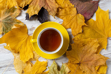 Flat lay autumn composition with cup of black tea