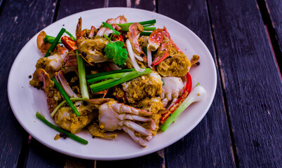 Stir fried crab with yellow curry powder. This is Asian food but  popular seafood in Thailand.