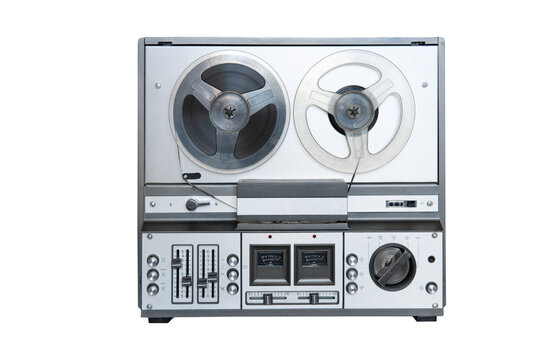 Stereo tape deck recorder player with reels on background.