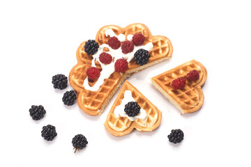 Belgium waffles with fresh berries isolated on white background
