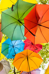Colorful umbrellas hanging at a cafe in Idar-Oberstein, Germany. 