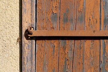 The old weathered door is closed. Copy space.